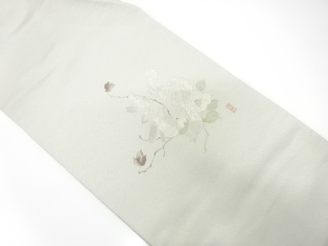 銀通し　椿に文字模様織り出し　名古屋帯